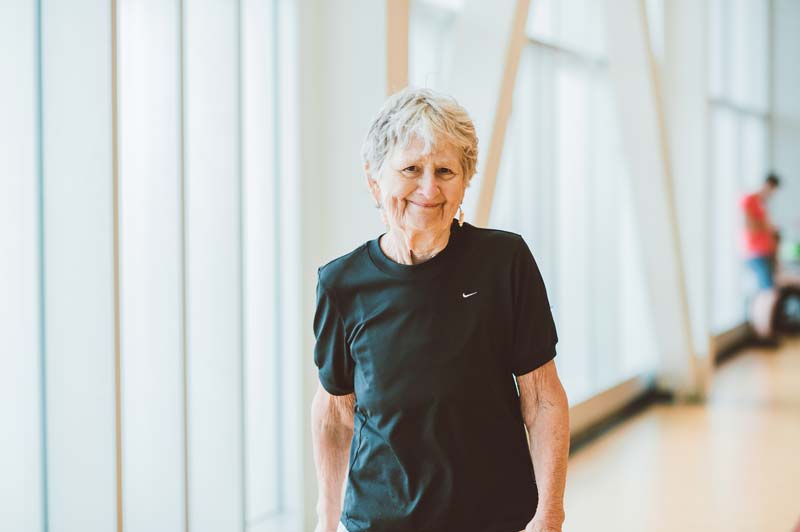 Elderly woman using walking track at YMCA