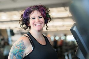 Woman smiling at the gym